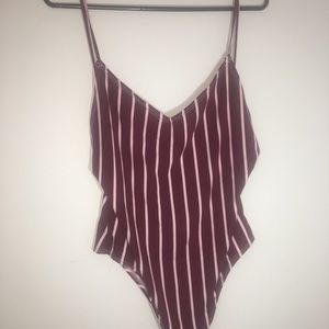 Cute backless body suit NEVER WORN